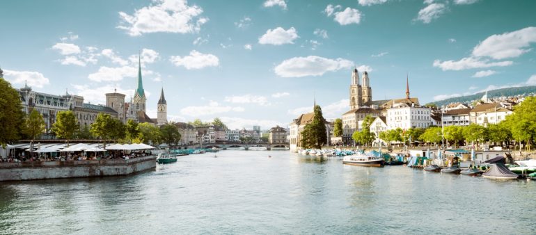 Panoramic view of historic Zurich city center with famous Fraumu